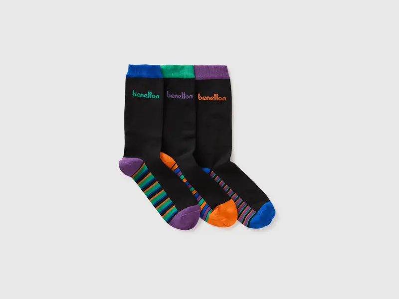 Three black socks with multicolored inserts