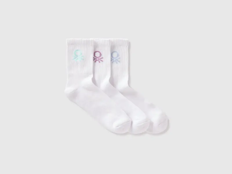 Three white socks with colored logo